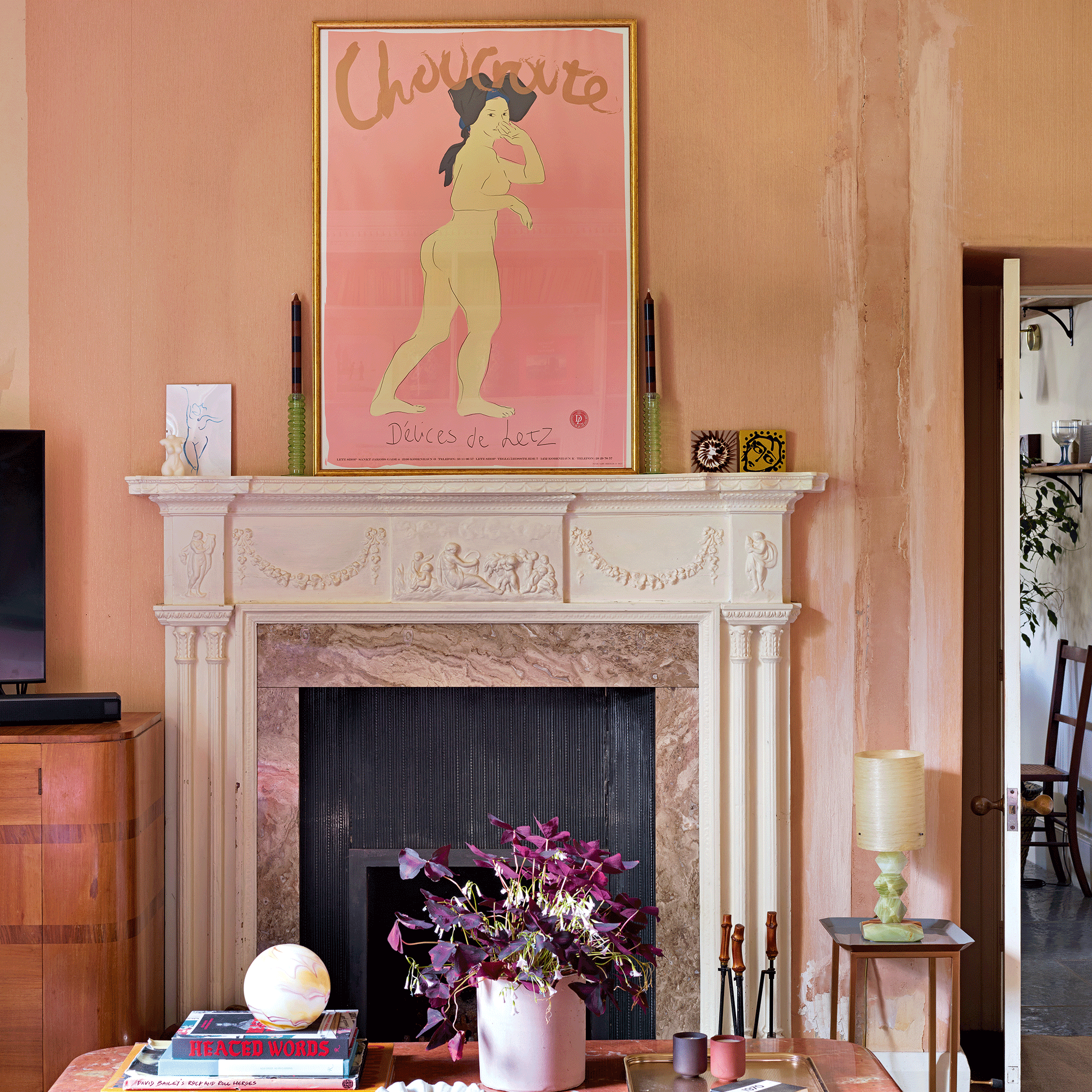 Large picture over a fireplace in pink room