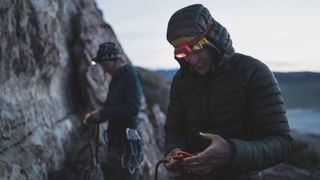 Climbers wearing Black Diamond Storm 500R headlamps