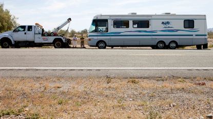 Two men with RV about to be towed near Yuma, Ariz.