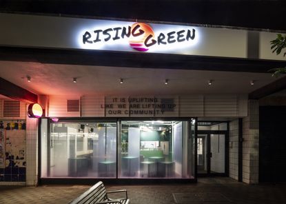 exterior at night of rising green community centre