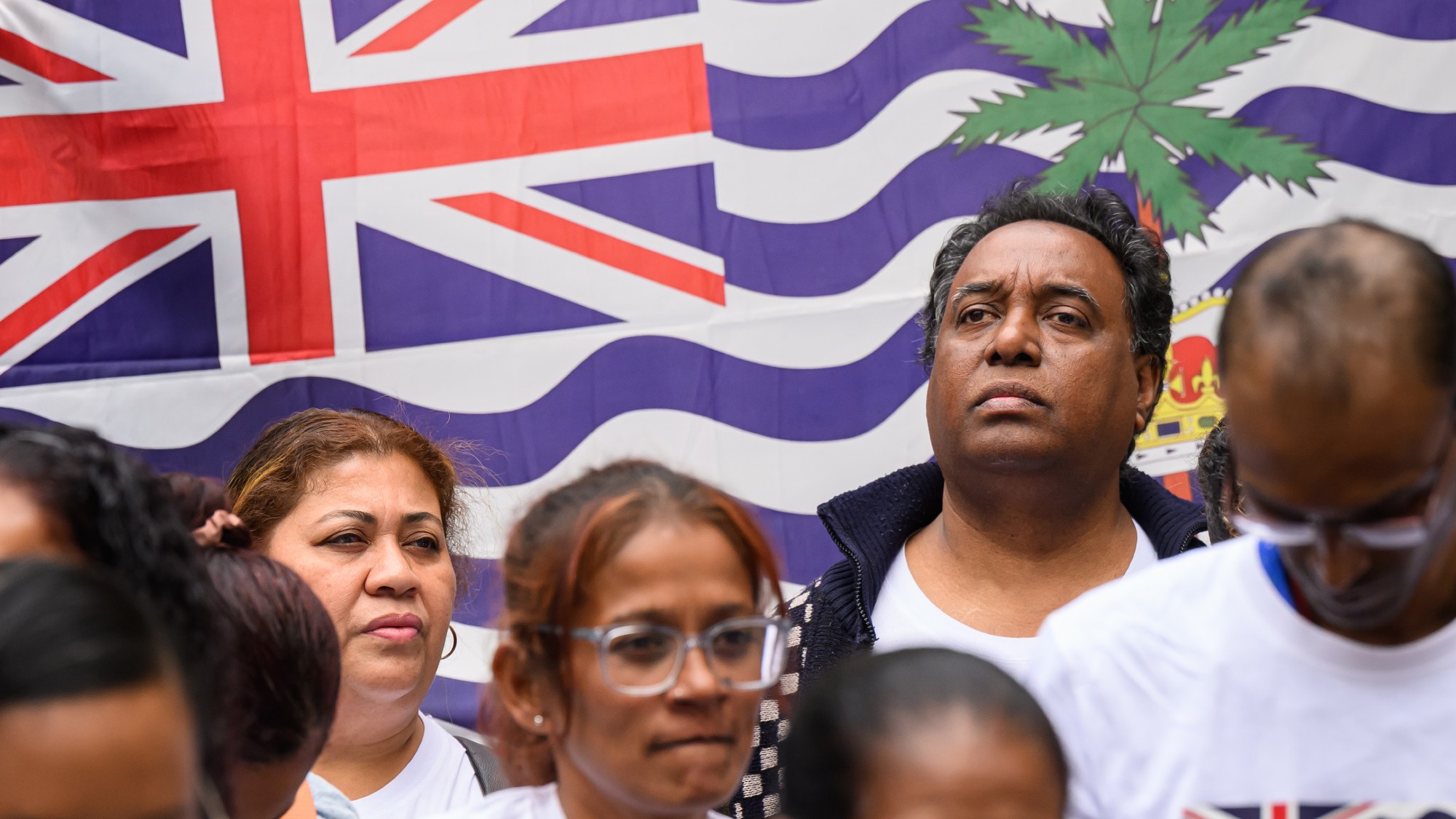 Demonstrators protest against the government's plans to return control of the Chagos Islands to Mauritius outside the High Court in London