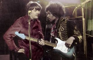 Chas Chandler (left) speaks to Jimi Hendrix while the latter rehearses for an appearance on the German TV Show Beat Club in 1967