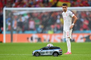 The Volkswagen remote control car brings the match ball onto the pitch ahead of the Euro 2020 semi-final between Italy and Spain in July 2021.