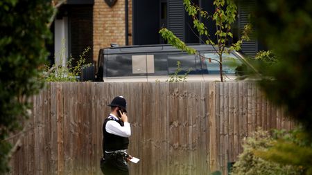 A police officer outside the Study Preparatory School in Wimbledon