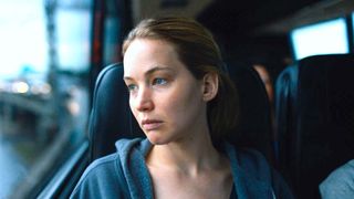 A make up-less Lynsey stares out of a bus window in Causeway