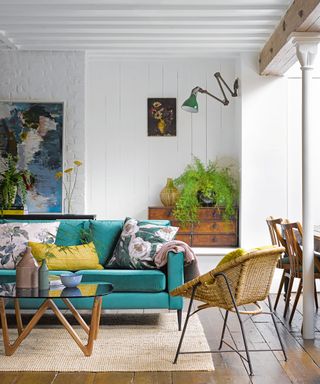 light living room with green sofa and rattan armchair