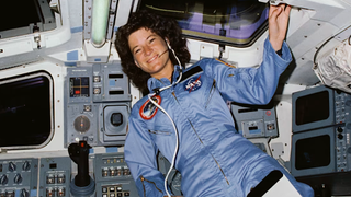 a female astronaut aboard the space shuttle