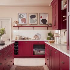 red kitchen cabinets and island with white tiles and countertop 