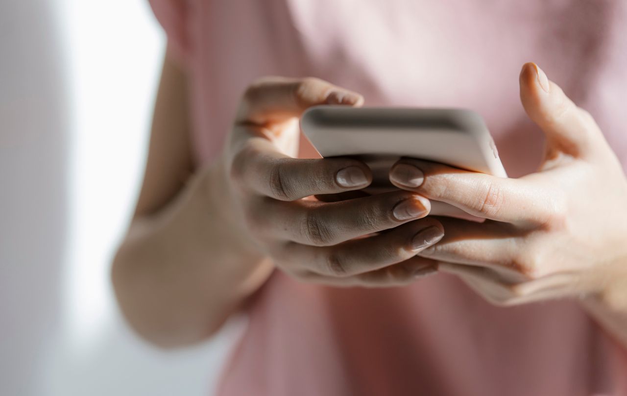 woman holding phone