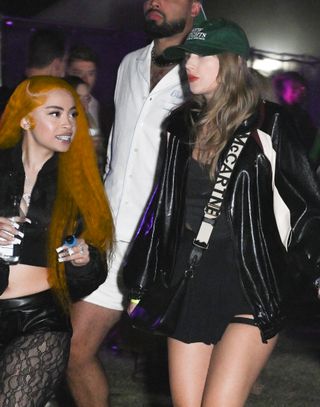 Taylor Swift walks with Ice Spice at Coachella while wearing an all black outfit