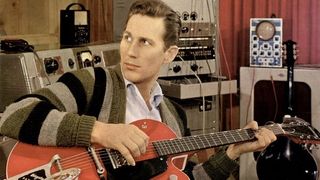 Chet Atkins pictured in the studio with his Gretsch 6119 Tennessean signature model