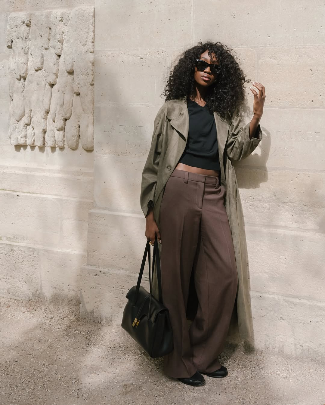 Emmanuelle in a trench and trousers outfit