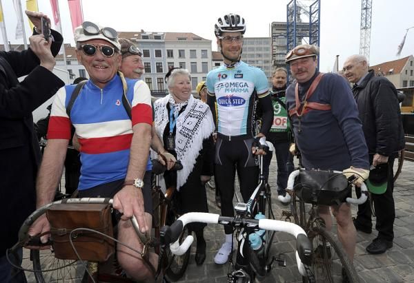 Tom Boonen poses with some fans before the race