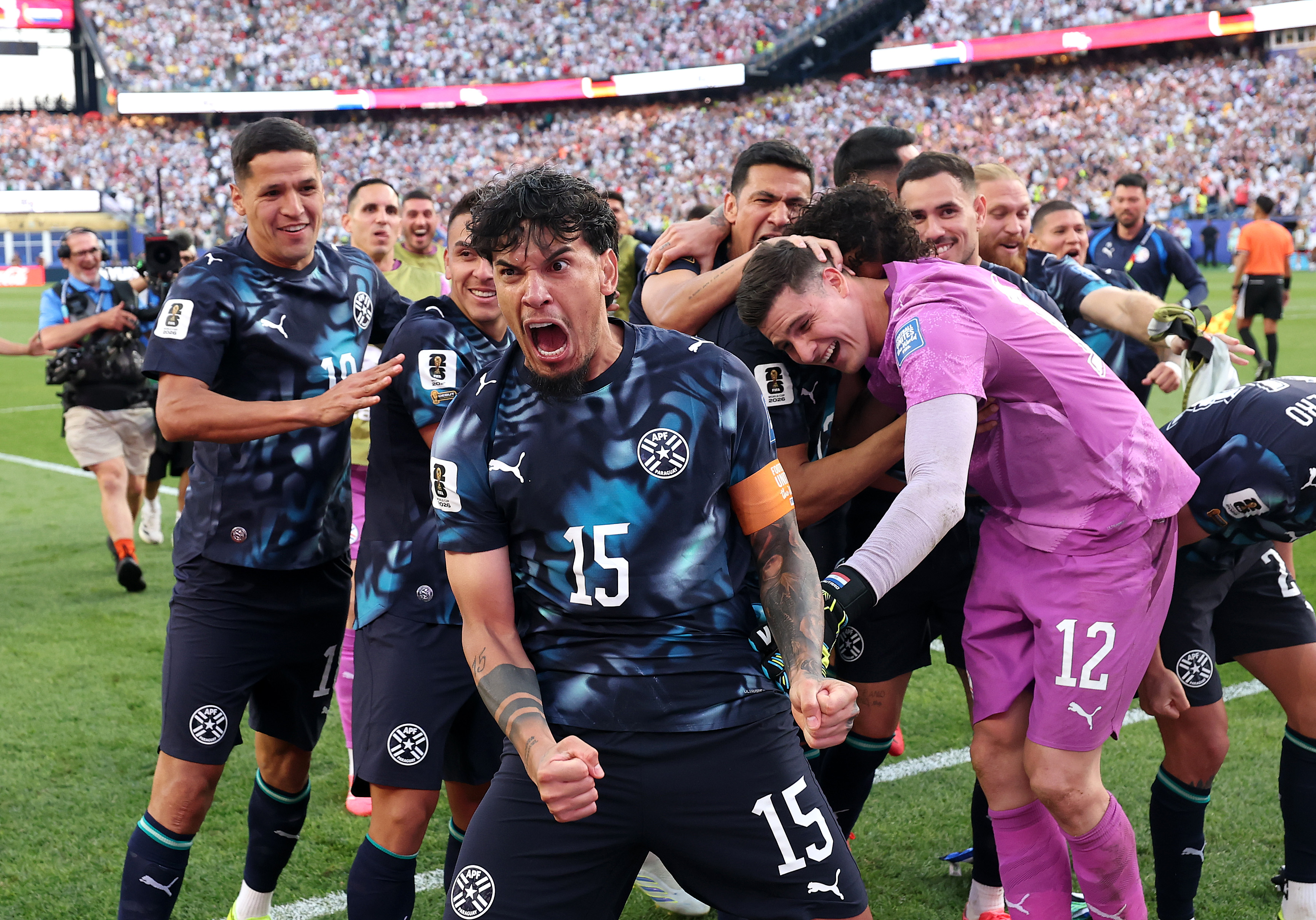 FOXBOROUGH, MASSACHUSETTS - JUNE 29: Gustavo Gomez #15 of Paraguay celebrates with teammates after Jose Canale #13 scores the winning penalty in a penalty shootout during the FIFA World Cup 2026 Round Of 32 match between Germany and Paraguay at Boston Stadium on June 29, 2026 in Foxborough, Massachusetts. (Photo by Alexander Hassenstein/Getty Images)