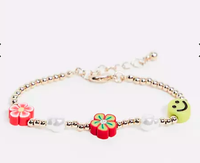 ASOS DESIGN Bracelet With Flower and Happy Face | $7.50