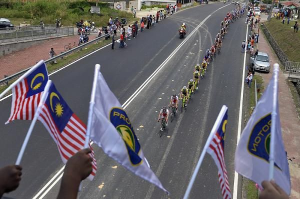 Fans with Malaysian flags show their support for the race.