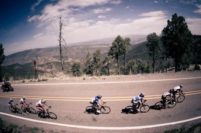 A small group passes over the highest KOM along the route.