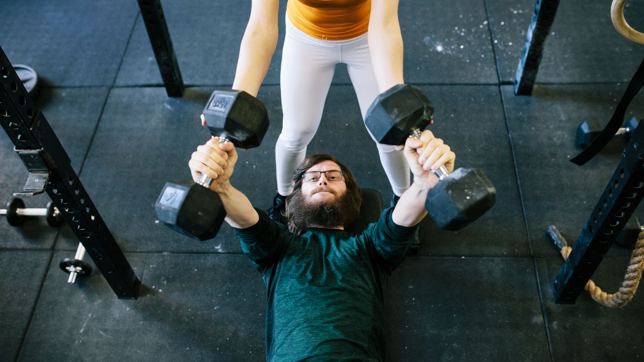 Man exercising with dumbbells