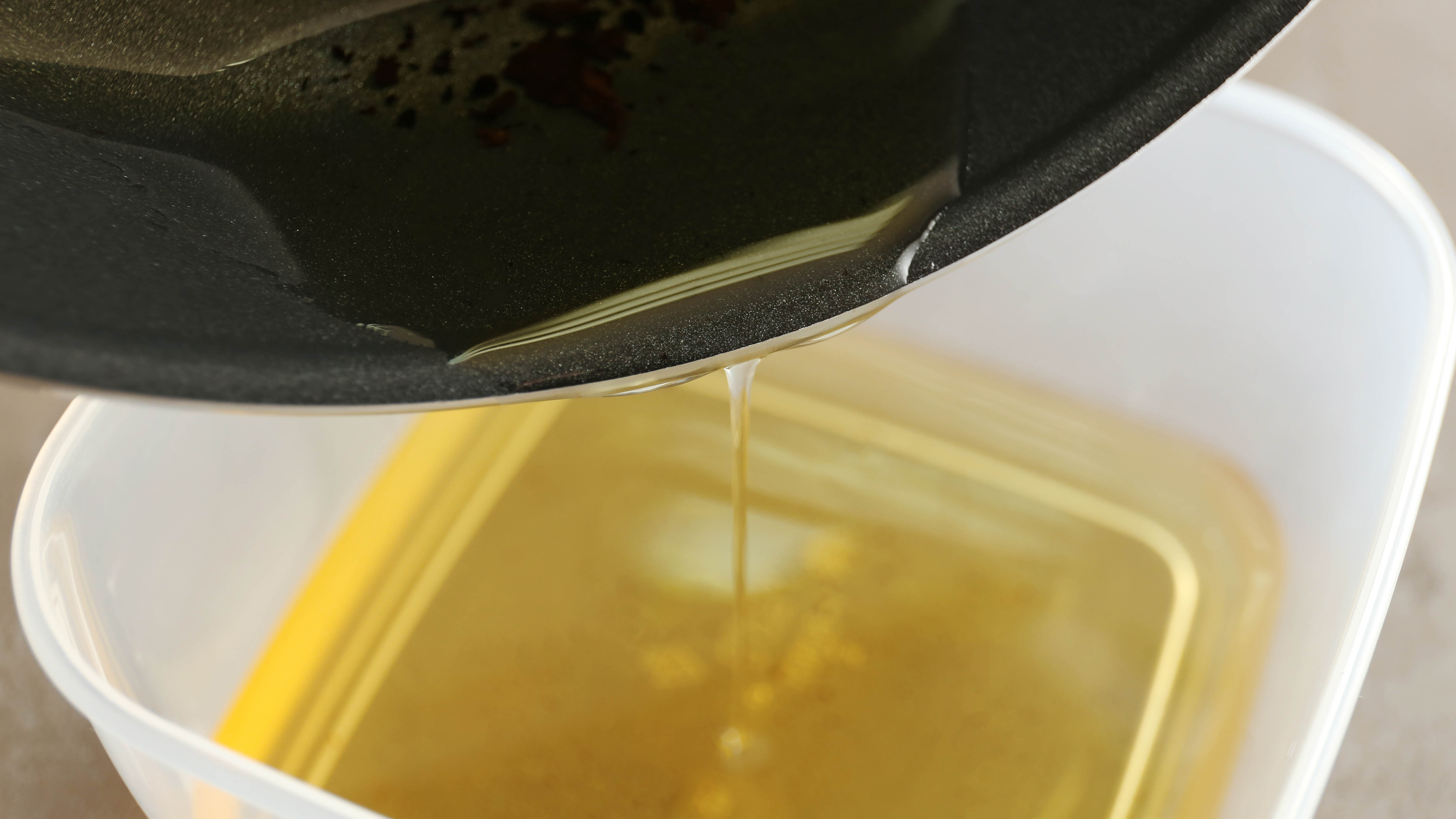 Pour oil into a container