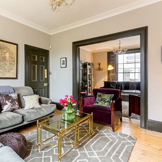 living room with double doors and wooden flooring