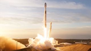 a white rocket lifts off into a partially cloudy dusk sky from its California launchpad