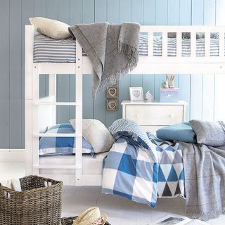 childs room with aspace bunk bed and colorful accessories