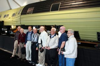 Phil Pressel (fourth from left) joins other National Reconnaissance Office veterans in a group photograph in front of the 60-foot long KH-9 HEXAGON spy satellite. This gathering of former NRO contractors was finally able to share stories of their once-secret work with family and friends at a celebration marking the NRO's 50th anniversary. The KH-9 was declassified and displayed at the Smithsonian National Air & Space Museum's Udvar-Hazy Center on Sept. 17, 2011.
