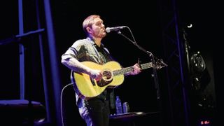 Brian onstage with his custom Martin 00-42