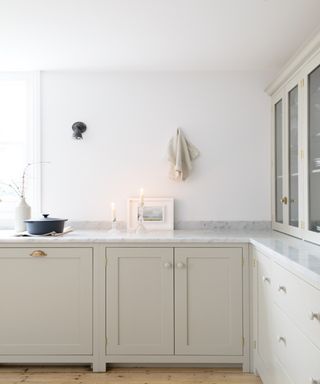 Cream cabinets, marble countertop