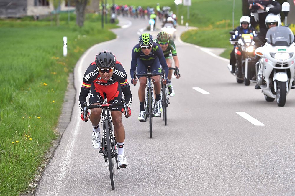 A gap forms off the front of the peloton
