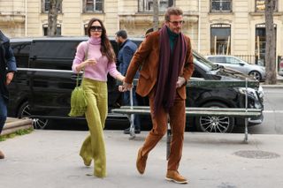 David and Victoria Beckham walk hand in hand in Paris