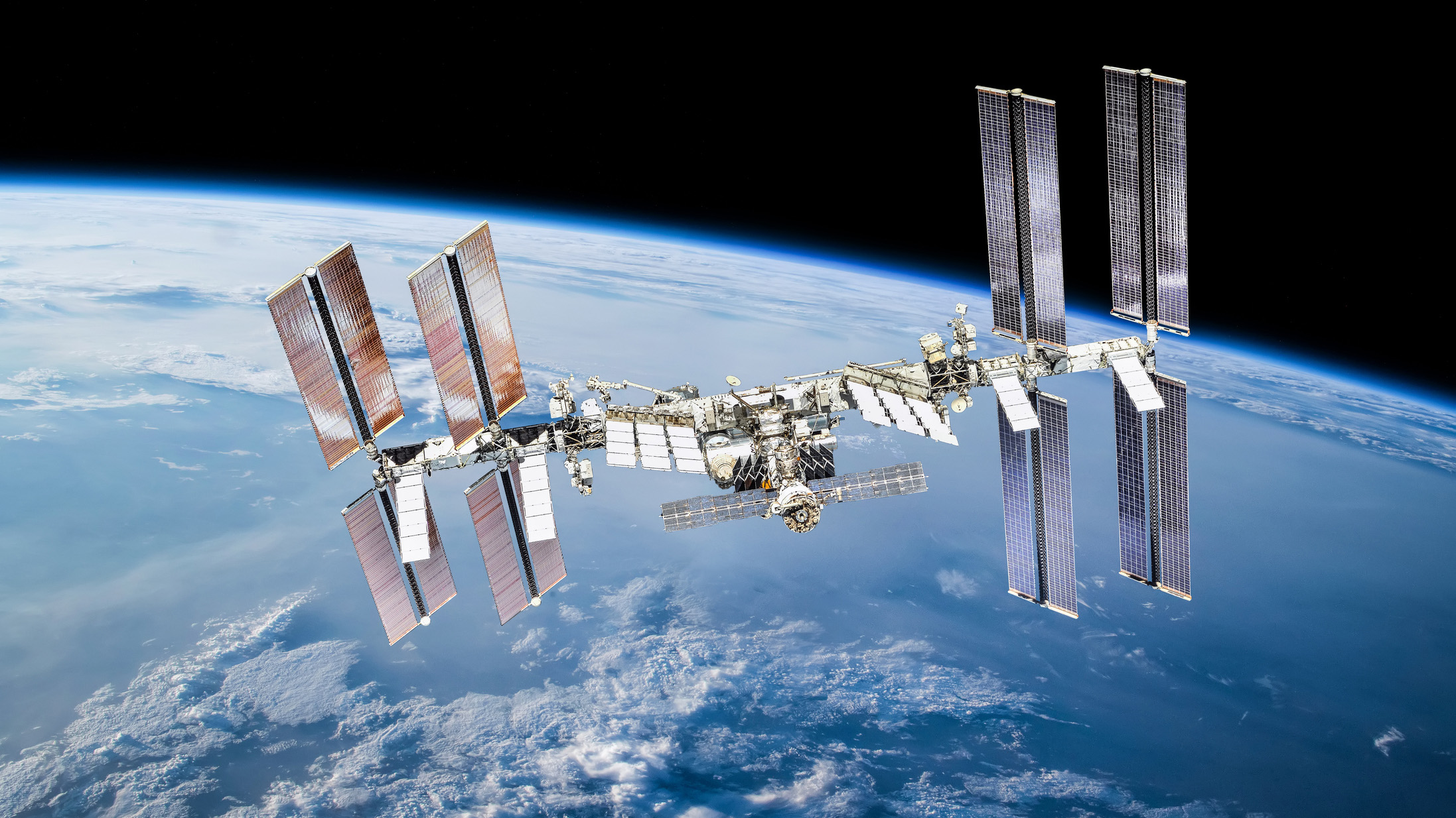 ISS station on orbit of the Earth planet. Elements of this image furnished by NASA - stock photo International space station with astronauts. Elements of this image furnished by NASA 