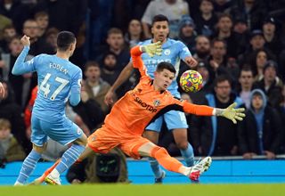 Phil Foden, left, opens the scoring