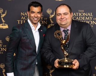 Founder Bogdan Frusina (right) holding one of two Emmys the company has won.