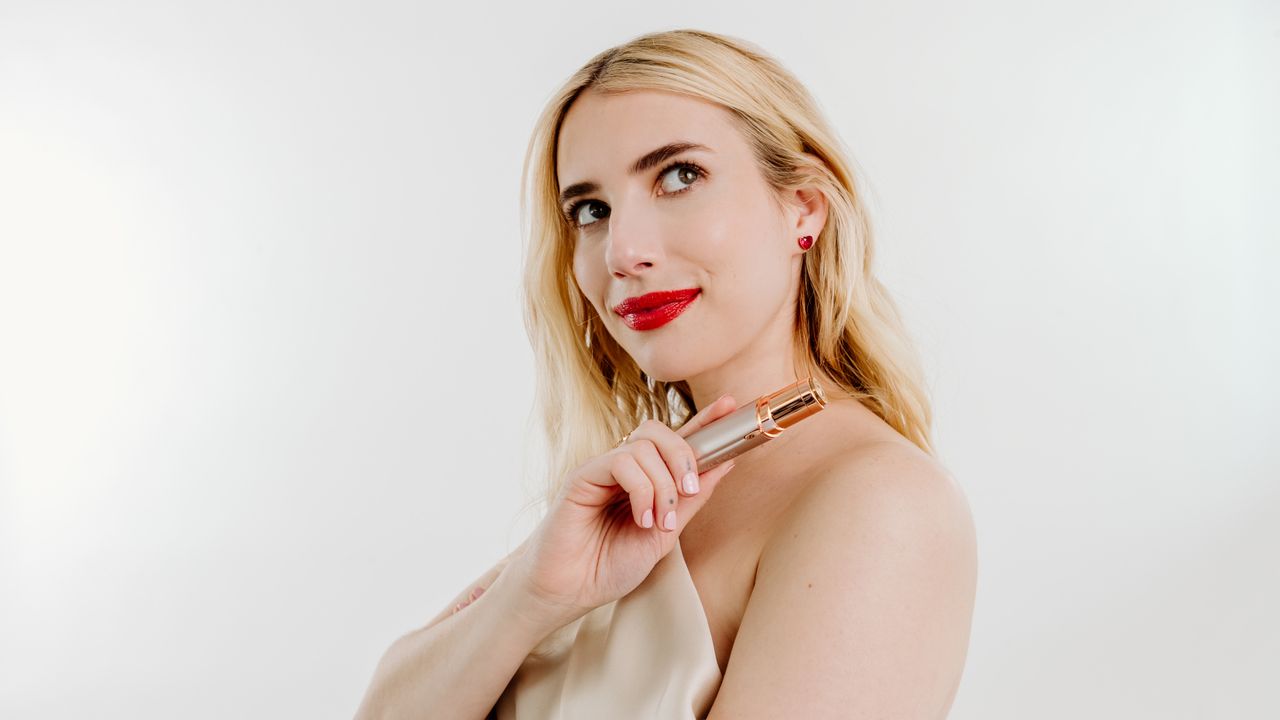 emma roberts holding hair removal device