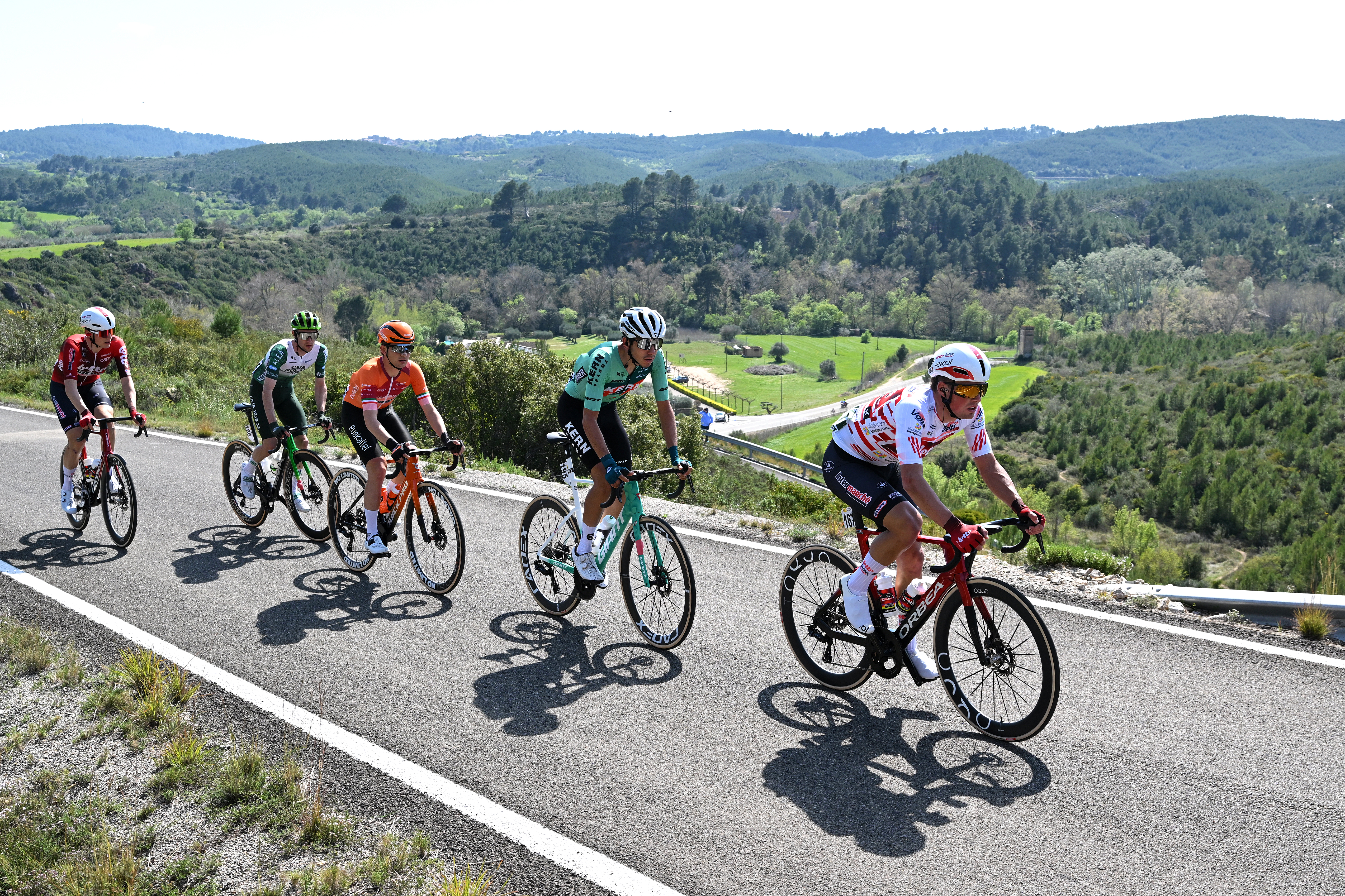 Baptiste Veistroffer leads a five man breakaway while wearing the white and red mountains jersey on stage 2 of the Volta a Catalunya 2026.