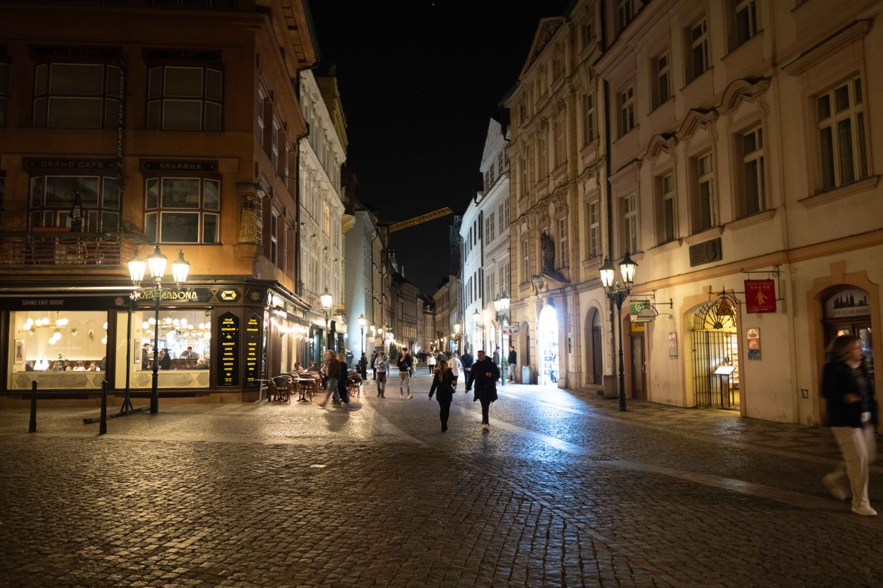 A street in Prague lit up at night