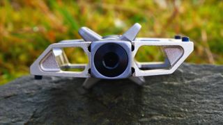 Crankbrothers Mallet Trail pedal on a rock and showing the thickness