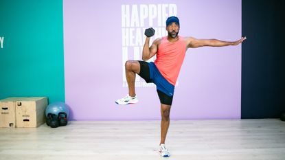 Man doing a standing oblique crunch.