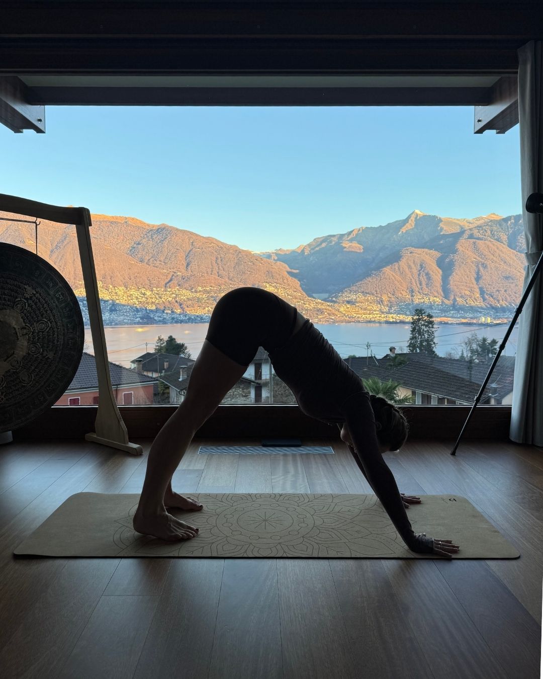 Georgia Brown performing a downward dog