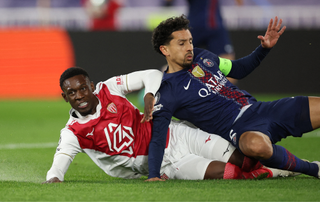 Monaco's US forward #09 Folarin Balogun (L) reacts after scoring his team's second goal during the UEFA Champions League knockout round play-off first leg football match between AS Monaco and Paris Saint-Germain at the Stade Louis II in the Principality of Monaco on February 17, 2026.