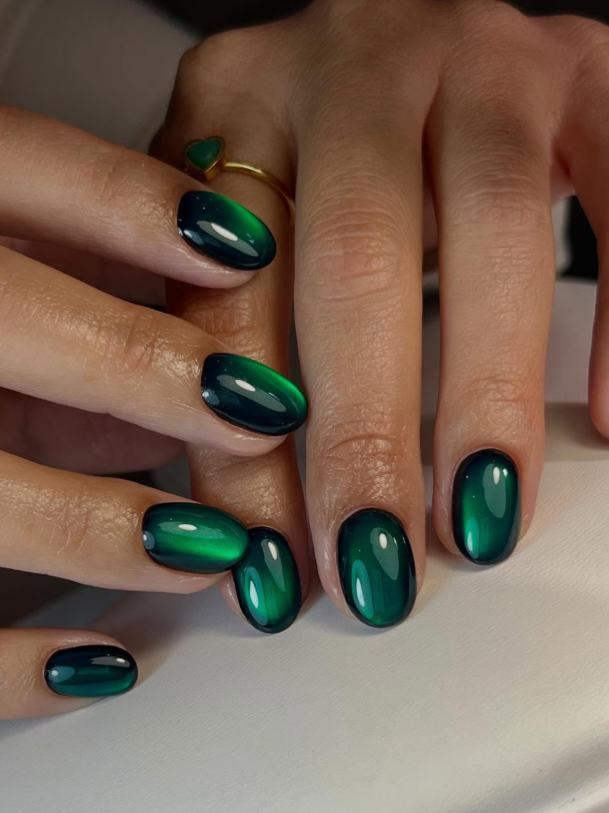 Emerald green cat eye nails by Joanne Thomas