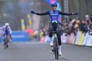 Lucinda Brand celebrates as she crosses the finish line to win the women's elite race of the Azencross