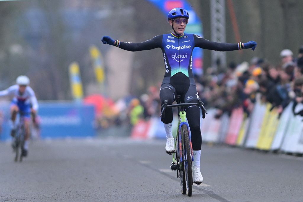 Lucinda Brand celebrates as she crosses the finish line to win the women's elite race of the Azencross