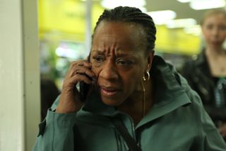 Marianne Jean-Baptiste, speaking into a cell phone, in HARD TRUTHS