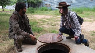 Carl in The Walking Dead with Siddiq.