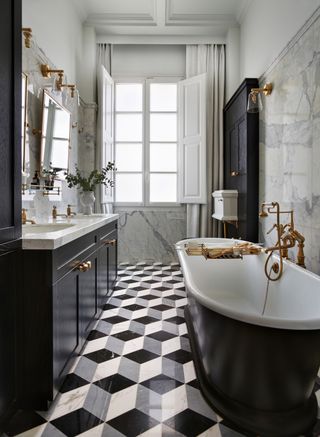 Cuschieri Architects Art Deco bathroom with a geometric marble floor and Drummonds' Humber bath