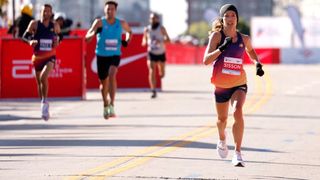 USA's Emily Sisson (R) approaches the finish line to place second in the women's division of the 2022 Bank of America Chicago Marathon in Chicago, Illinois, on October 9 2022