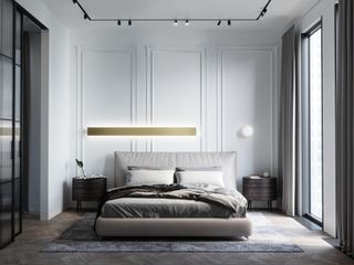 A bedroom with a long accent lighting piece behind it