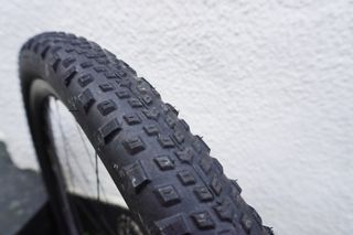 One American Classic gravel tyre leaning against a wall